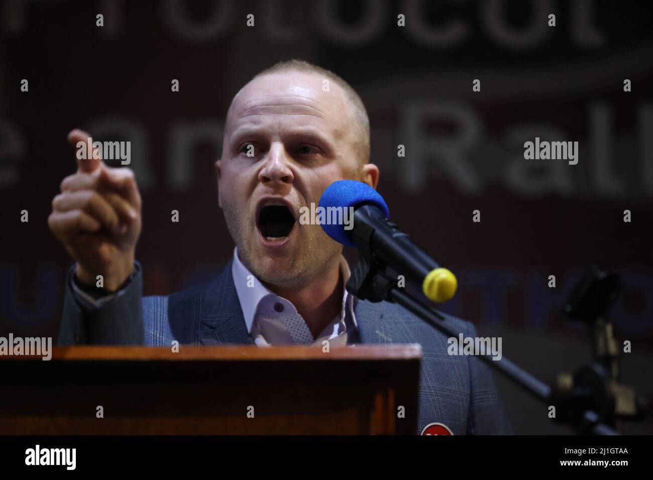 Loyalist blogger Jamie Bryson speaks during a anti Northern Ireland Protocol rally and parade, organised by North Antrim Amalgamated Orange Committee, in Ballymoney, Co Antrim. Picture date: Friday March 25, 2022. Stock Photo