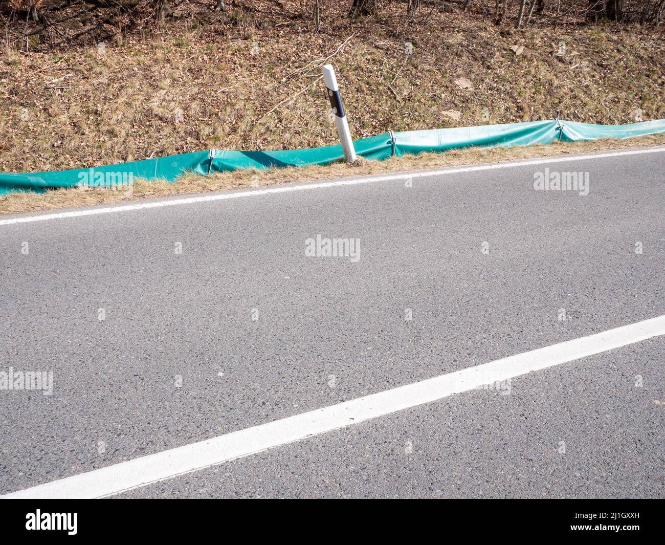 Fence to protect frogs from the road Stock Photo