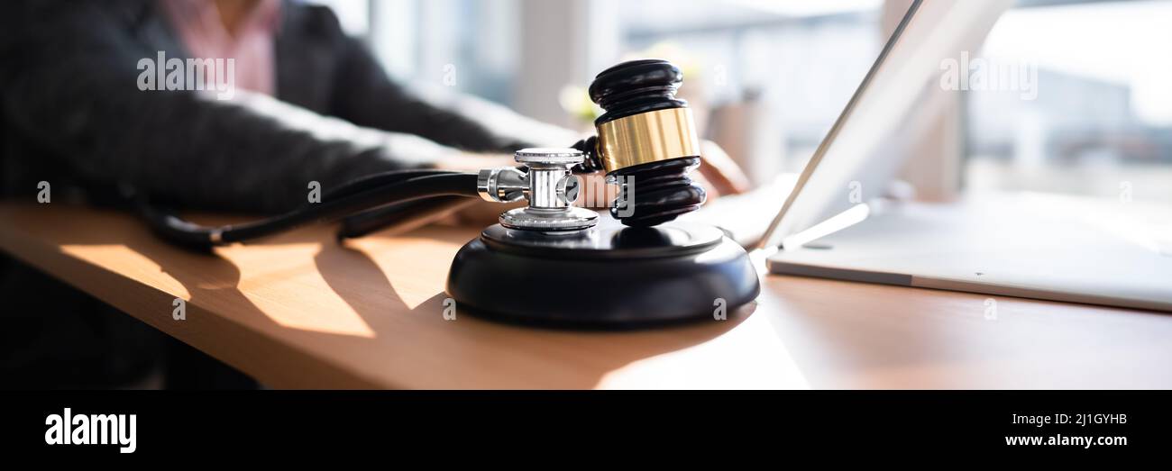 Doctor Malpractice Court. Law Gavel And Stethoscope In Courtroom Stock Photo
