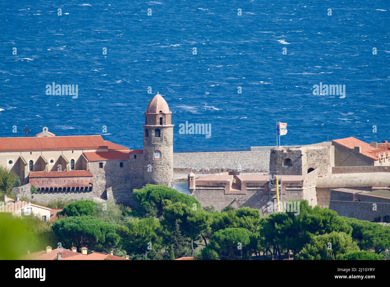 Steeple of Collioure in front of the ocean Stock Photo