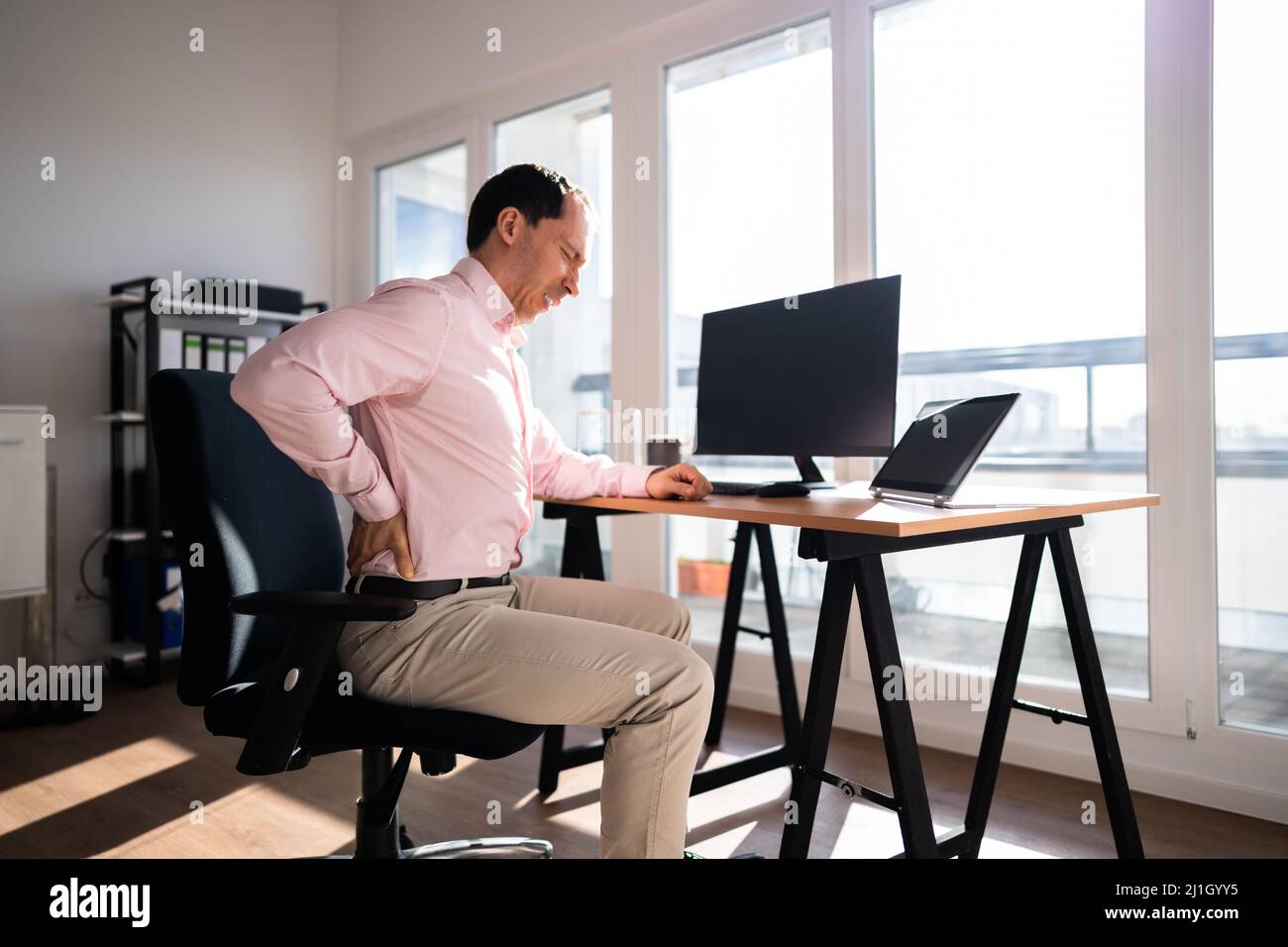 Bad Posture Office Desk Chair Back Pain Stock Photo Alamy