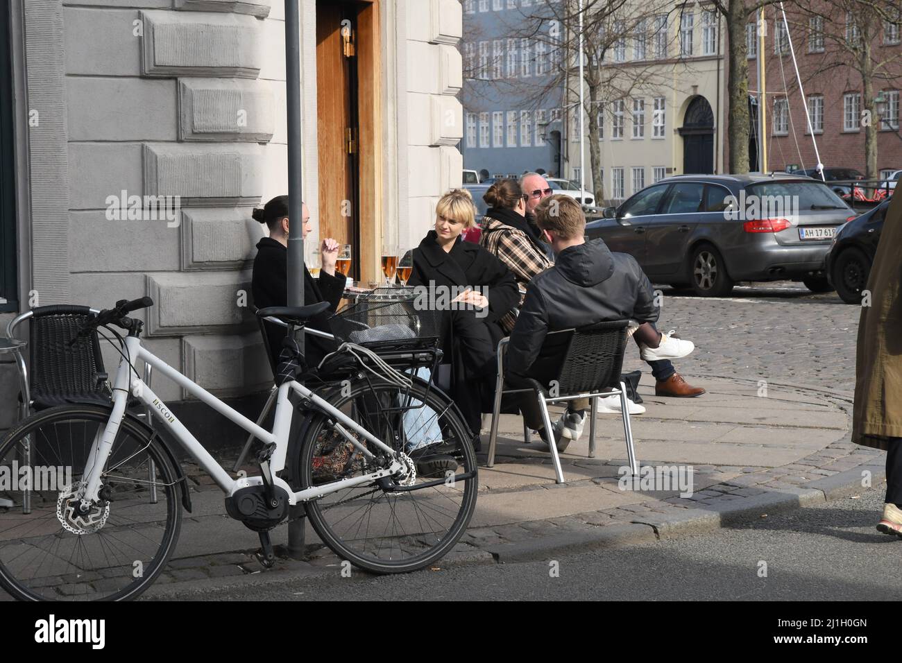 Copenhagen/Denmark/.25 .March 2022/.Customers enjoy out doot servie on sun shine weather at hristianshavn canal in capital.    (Photo..Francis Dean/Dean Pictures) Stock Photo