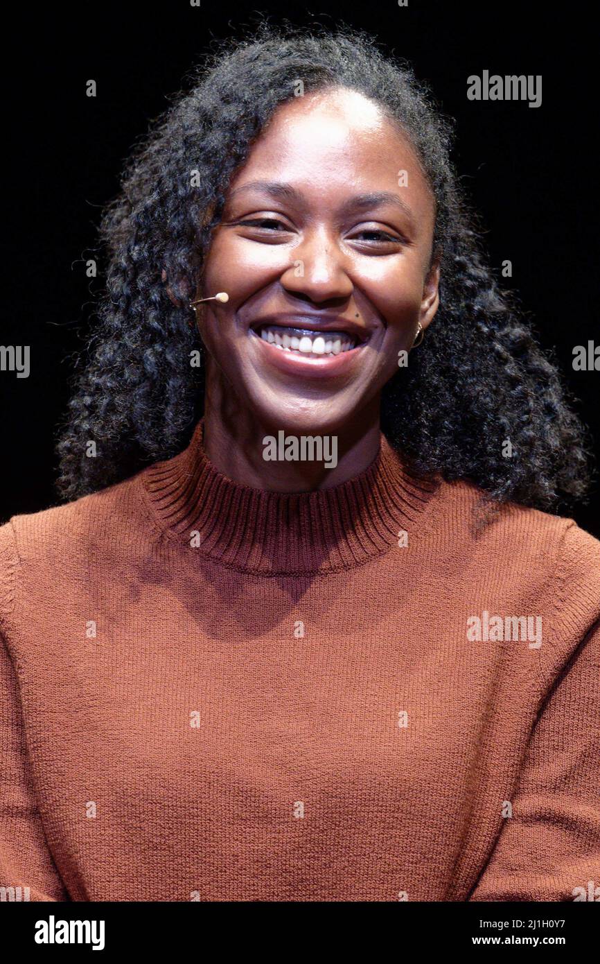 Cologne, Germany. 25th Mar, 2022. Author Natasha Brown sits on stage at an event as part of the Lit.Cologne literature festival. Credit: Henning Kaiser/dpa/Alamy Live News Stock Photo