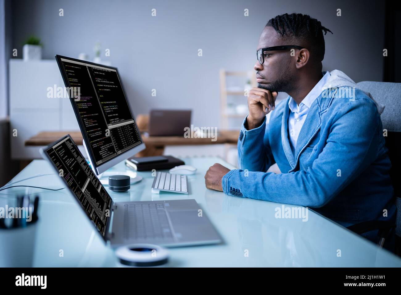 Software Programmer Coder Working On Computer At Night Stock Photo