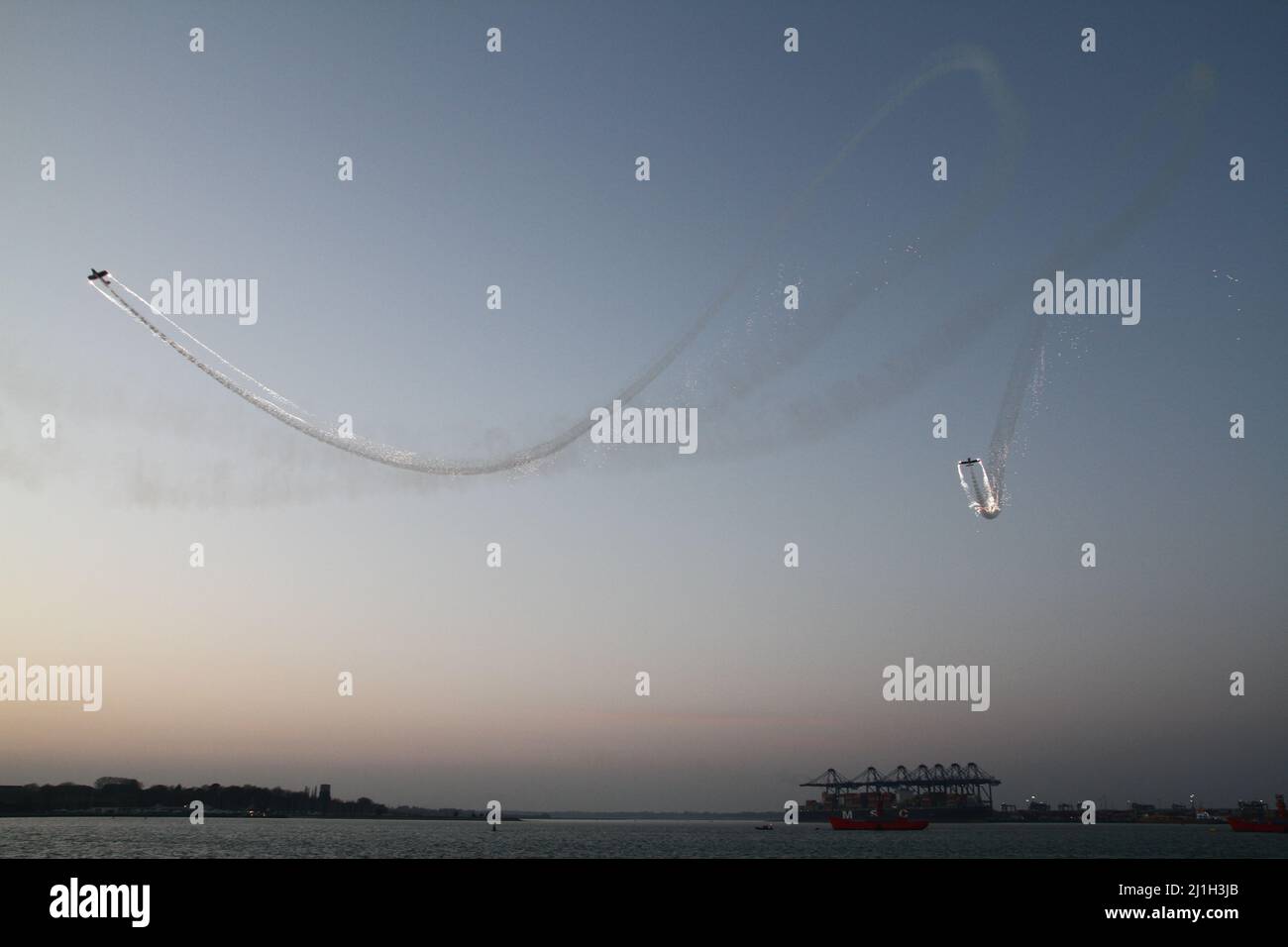 Harwich, UK. 25th Mar 2022. Aerobatic display from the Firebirds around Harwich Quay as part of the Harwich Illuminate festival celebrating the history of Harwich. Credit: Eastern Views/Alamy Live News Stock Photo