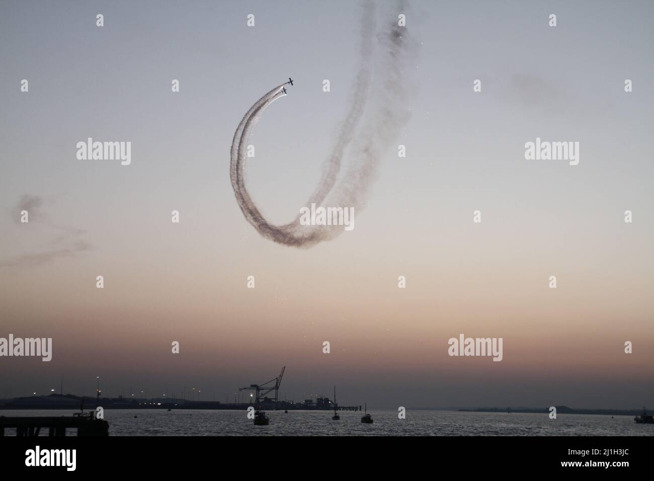 Harwich, UK. 25th Mar 2022. Aerobatic display from the Firebirds around Harwich Quay as part of the Harwich Illuminate festival celebrating the history of Harwich. Credit: Eastern Views/Alamy Live News Stock Photo