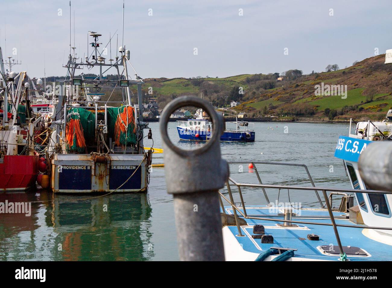 View through hole of trawler coming into harbour Stock Photo