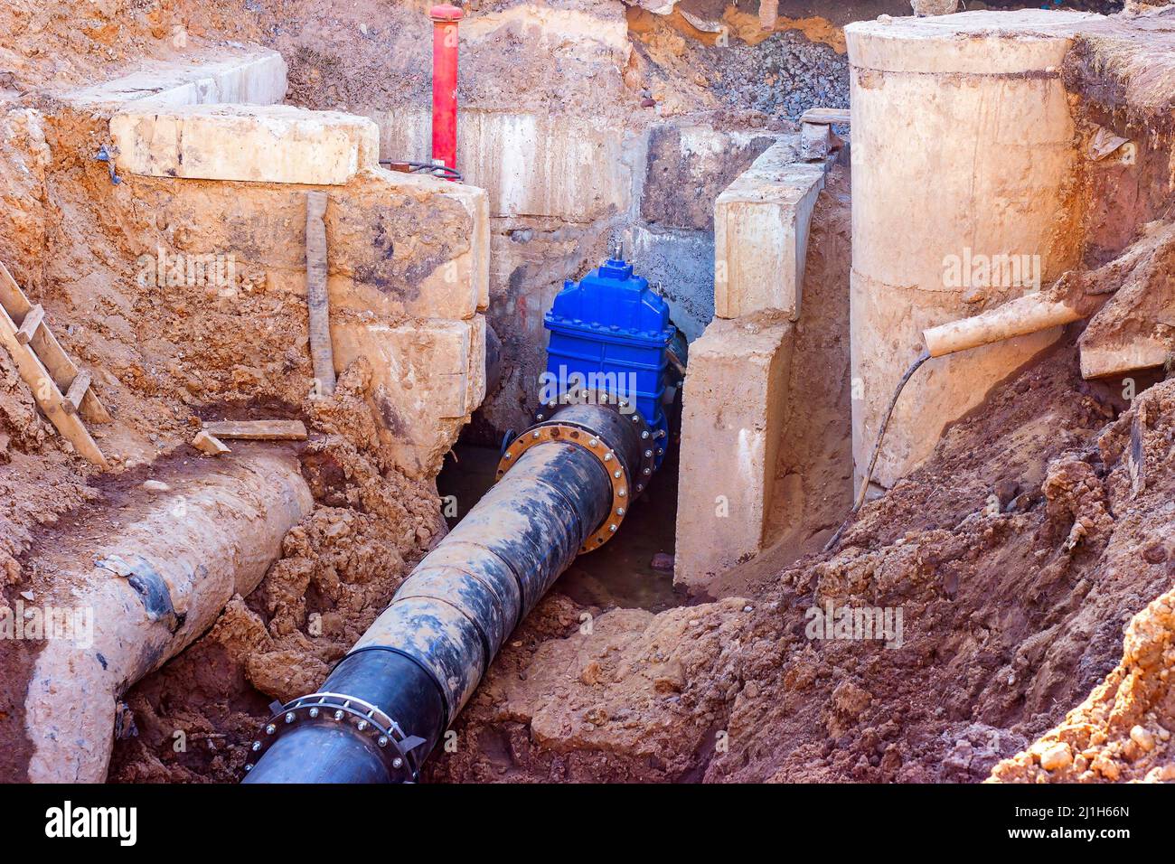 Connection of the construction of main city water blue supply pipeline  Stock Photo - Alamy