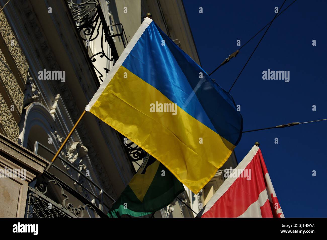 Flag of Ukraine billowing in the sun. Real flag seen outdoors. Stock Photo
