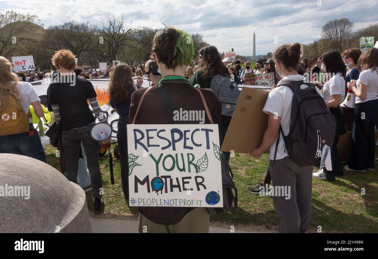 Demonstrators demanding President Biden take concrete actions to deal with climate change crisis at the Global Climate Strike rally near the US Capitol after marching from a rally at the White House. March 25, 2022. Stock Photo