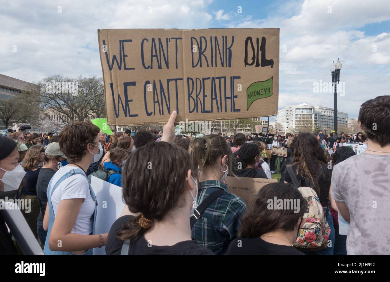 March 25, 2022. Demonstrators demanding President Biden take concrete actions to deal with climate change crisis at the Global Climate Strike rally near the US Capitol after marching from ta rally at the Whaire House. Stock Photo