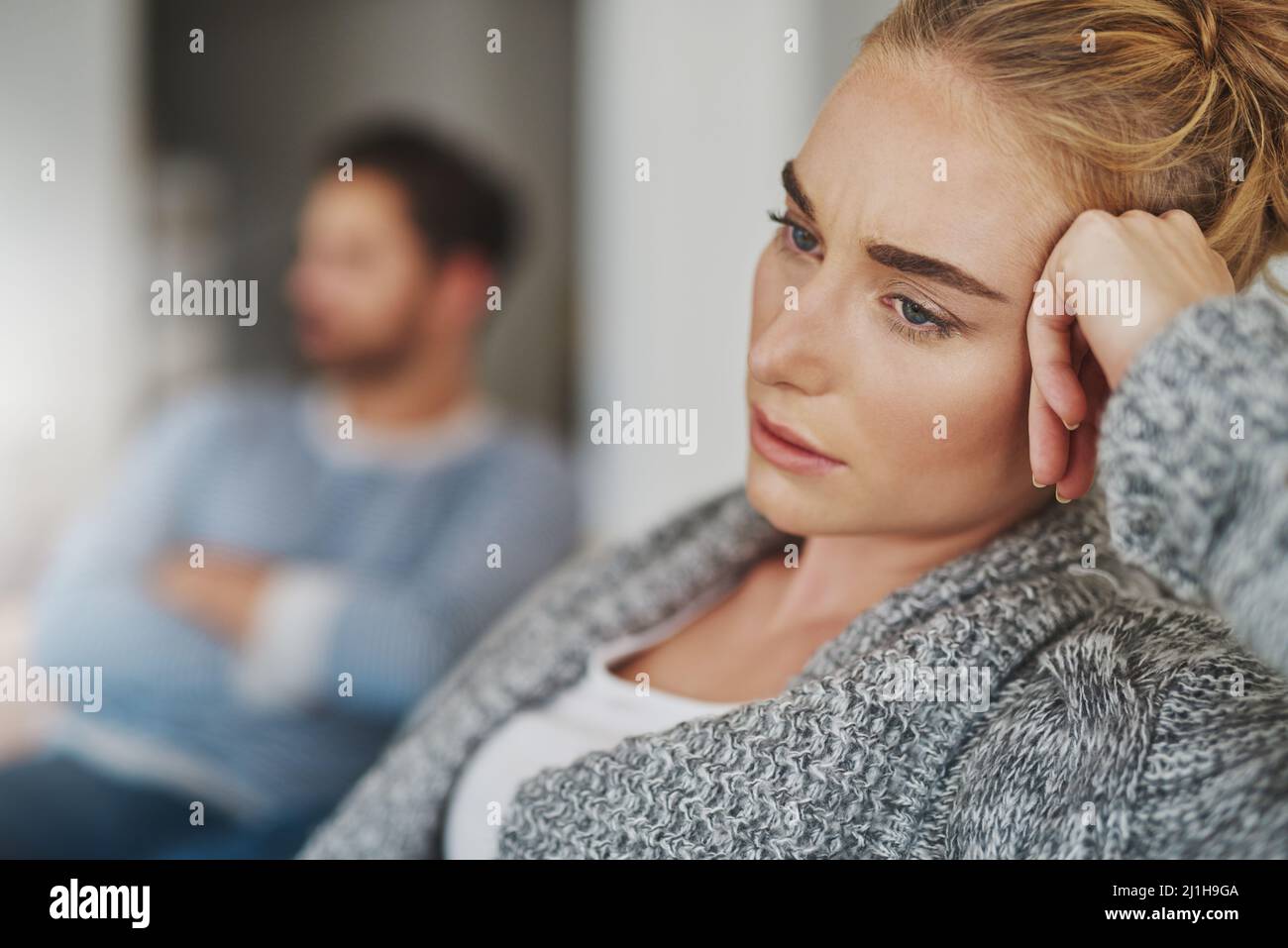How do I get my marriage back on track. Cropped shot of an unhappy young couple after a fight at home. Stock Photo