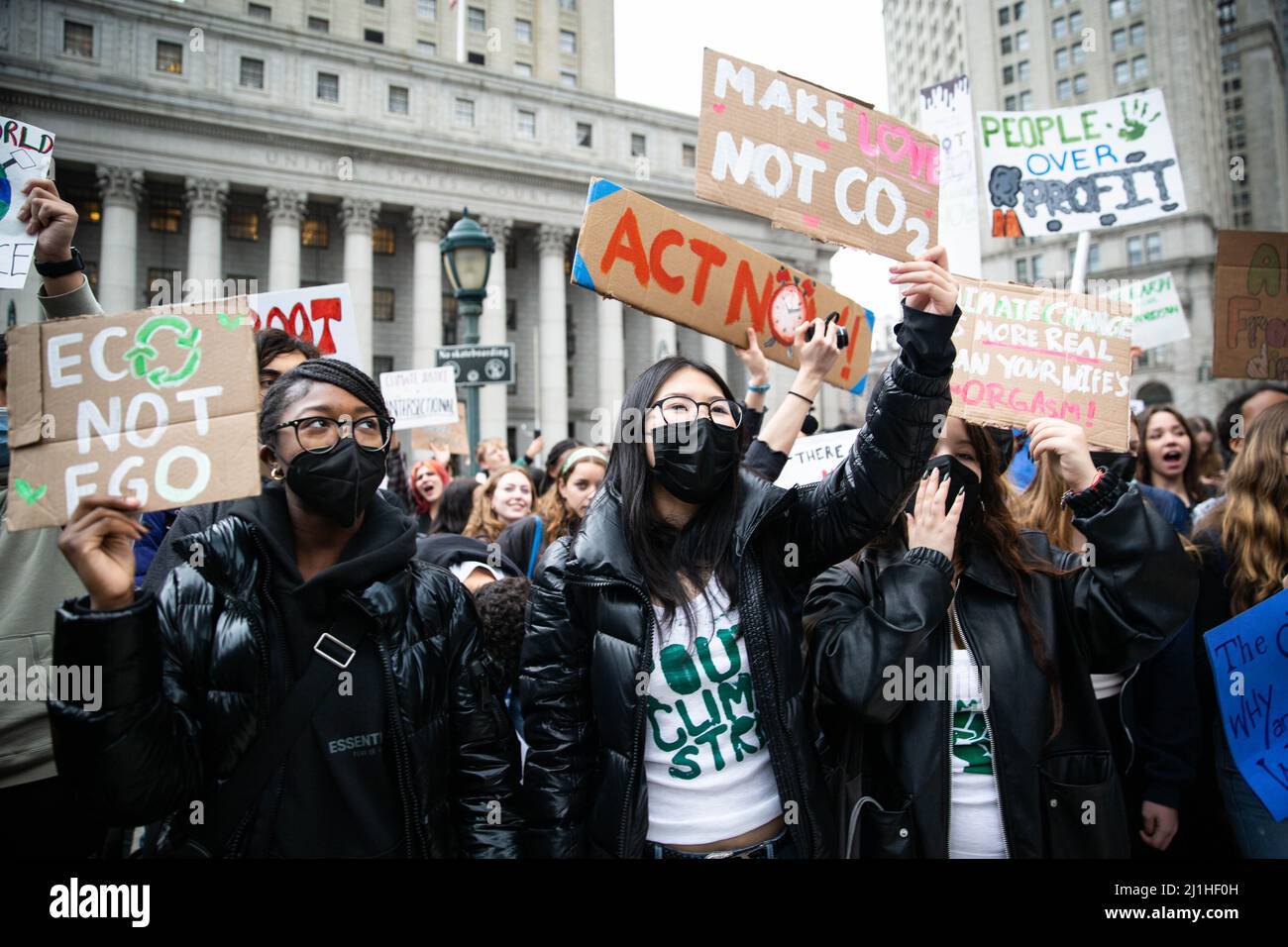 New York, USA. 25th Mar, 2022. Protesters hold climate activism signs during the demonstration. Over a thousand youth climate activists marched from Brooklyn Borough Hall across the Brooklyn Bridge to Foley Square as part of a global climate strike. Credit: SOPA Images Limited/Alamy Live News Stock Photo