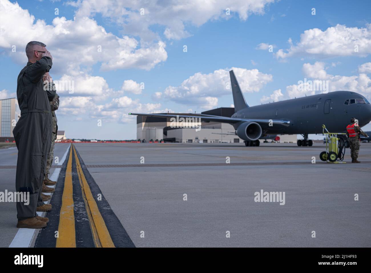 Members of the 305th Air Mobility Wing welcome a new KC-46A Pegasus as it arrives at Joint Base McGuire-Dix-Lakehurst, New Jersey, Mar. 18, 2022.  U.S. Air Force Lt. Gen. Brian Robinson, Air Mobility Command deputy commander, personally delivered the aircraft to the 305th and 514th Air Mobility Wings who operate and maintain the aircraft with installation support from the 87th Air Base Wing. This is the sixth KC-46 of the expected 24 that will be stationed at Joint Base MDL. (U.S. Air Force photo by Senior Airman Joseph Morales) Stock Photo