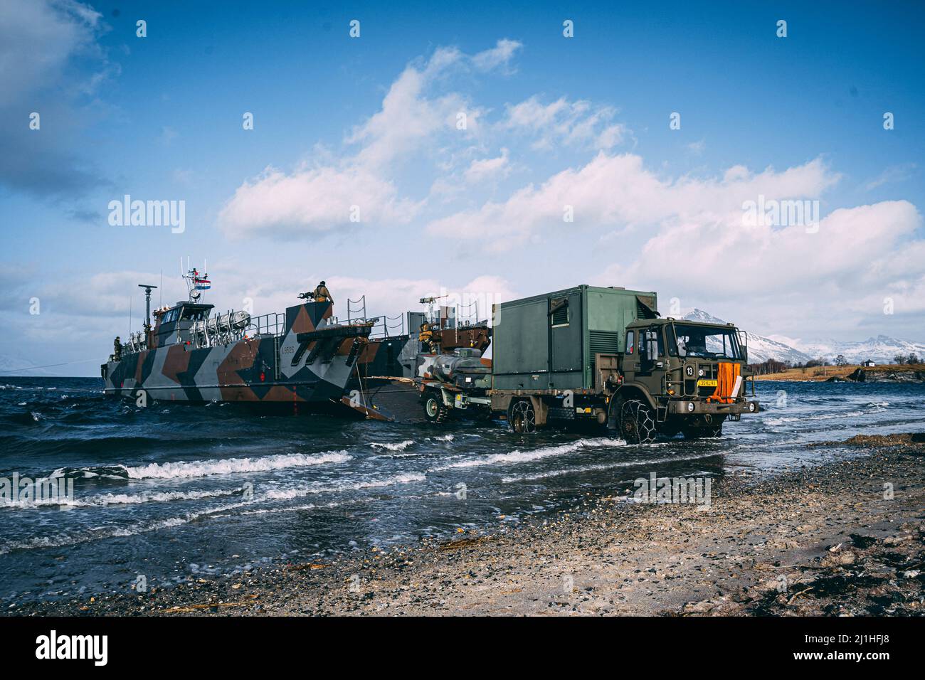 Korps Mariniers with the Royal Netherlands Marine Corps conduct an amphibious landing with a Landing Craft Utility (LCU) during Exercise Cold Response 22 in Sandstrand, Norway, March 21, 2022. Exercise Cold Response 22 is a biennial Norwegian national readiness and defense exercise that takes place across Norway, with participation from each of its military services, including 26 North Atlantic Treaty Organization (NATO) allied nations and regional partners. (U.S. Marine Corps photo by Sgt. William Chockey) Stock Photo