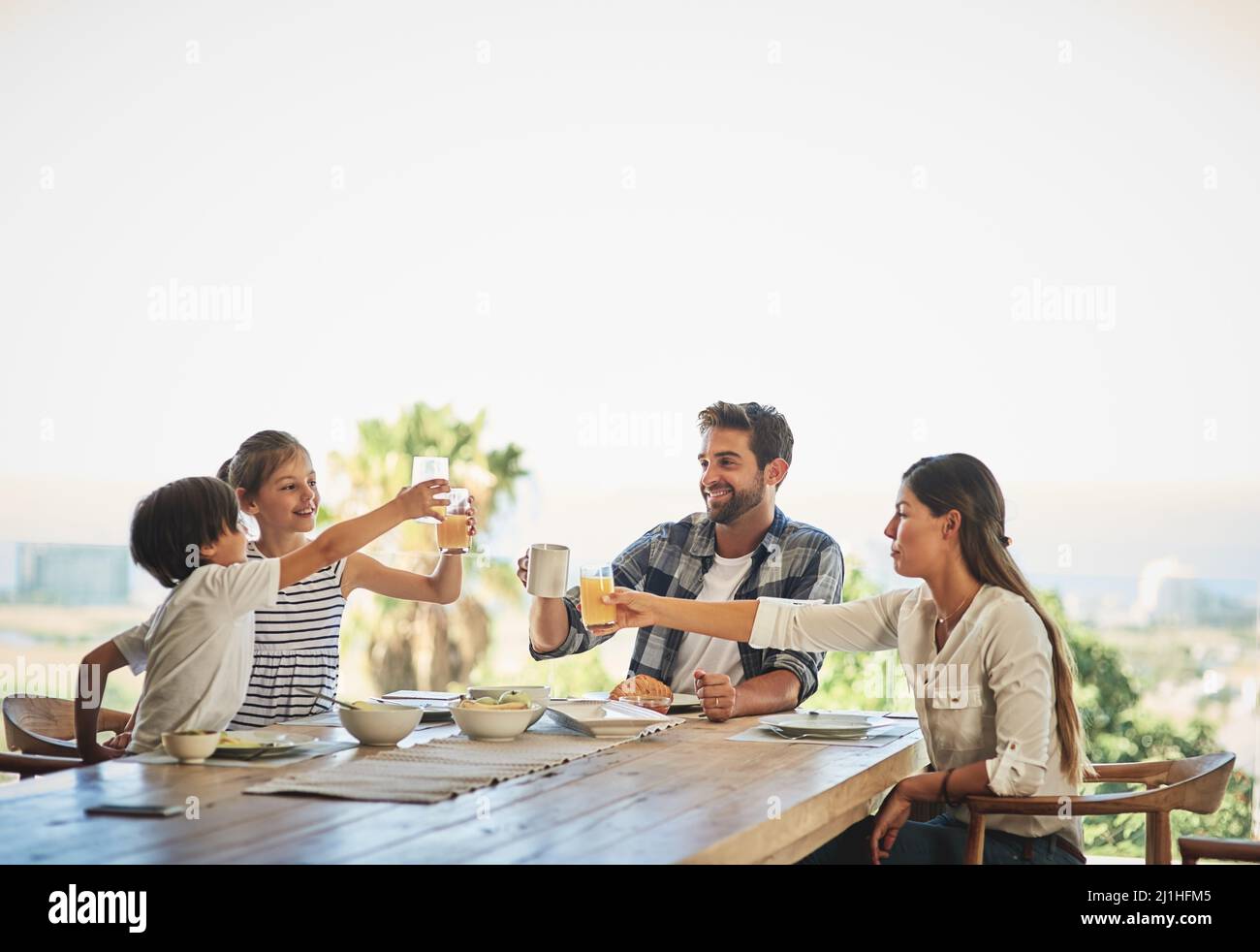 Having breakfast together is vital part of their family. Shot of a family having breakfast together at home. Stock Photo