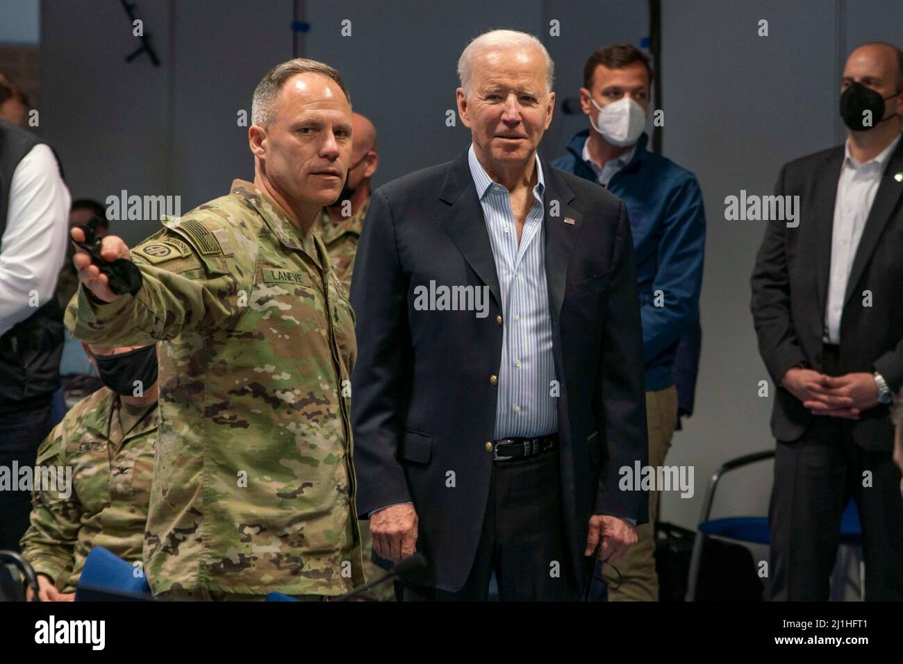 Jasionka, Poland. 25th Mar, 2022. U.S President Joe Biden, is introduced to the troops by Army Maj. Gen. Christopher C. LaNeve, the commanding general of the 82nd Airborne Division, during a visit March 25, 2022 in Jasionka, Poland. Biden visited the 82nd Airborne Division deployed to southeastern Poland in support of NATO. Credit: Sgt. Claudia Nix/U.S. Army/Alamy Live News Stock Photo