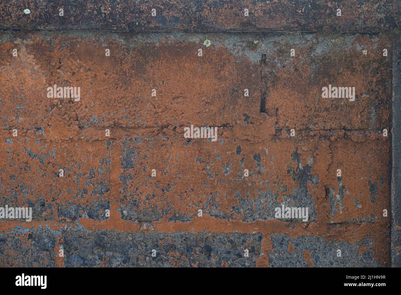 Close up of old dirty red brick and concrete wall texture background ...