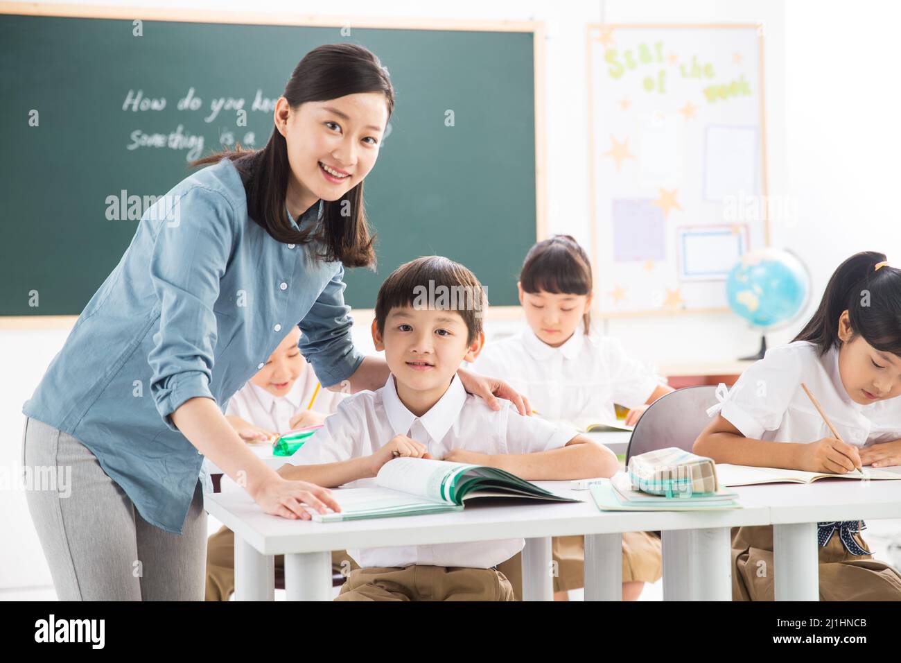 Teachers And Pupils In The Classroom Stock Photo - Alamy