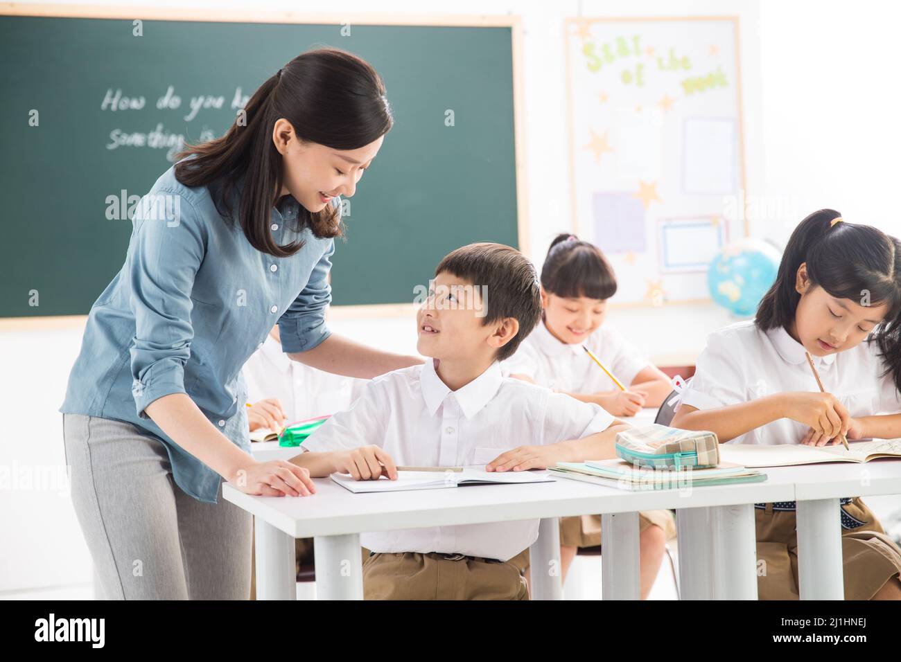 Teachers and pupils in the classroom Stock Photo - Alamy