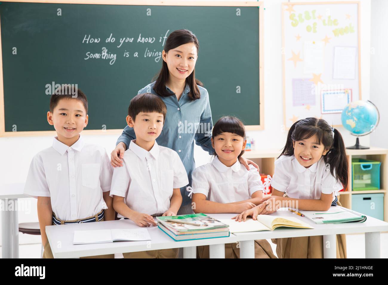 Teachers and pupils in the classroom Stock Photo - Alamy