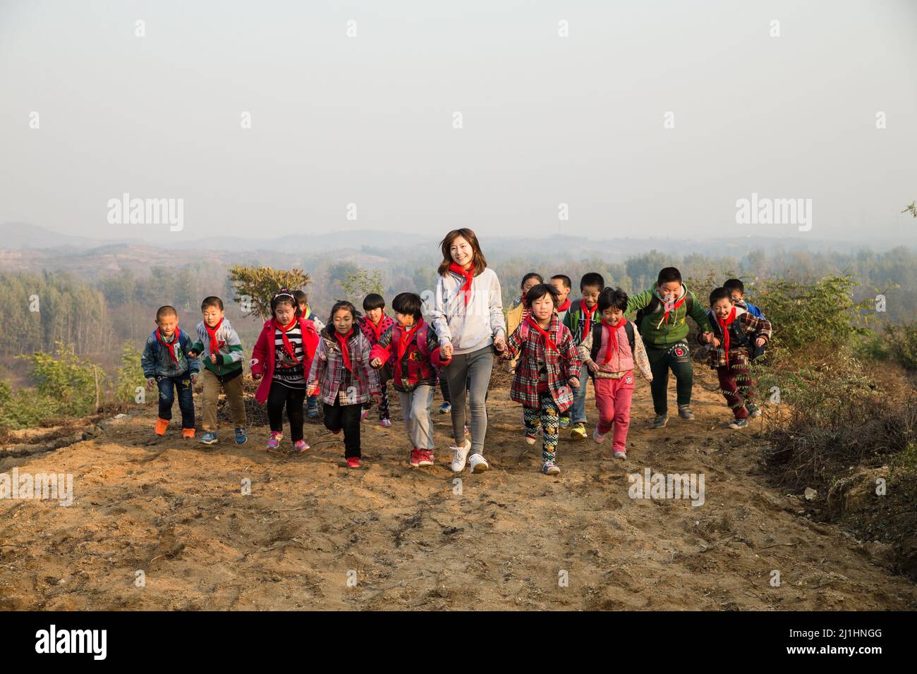 Small Group Teaching Rural Rural women teachers and students in the play Stock Photo - Alamy