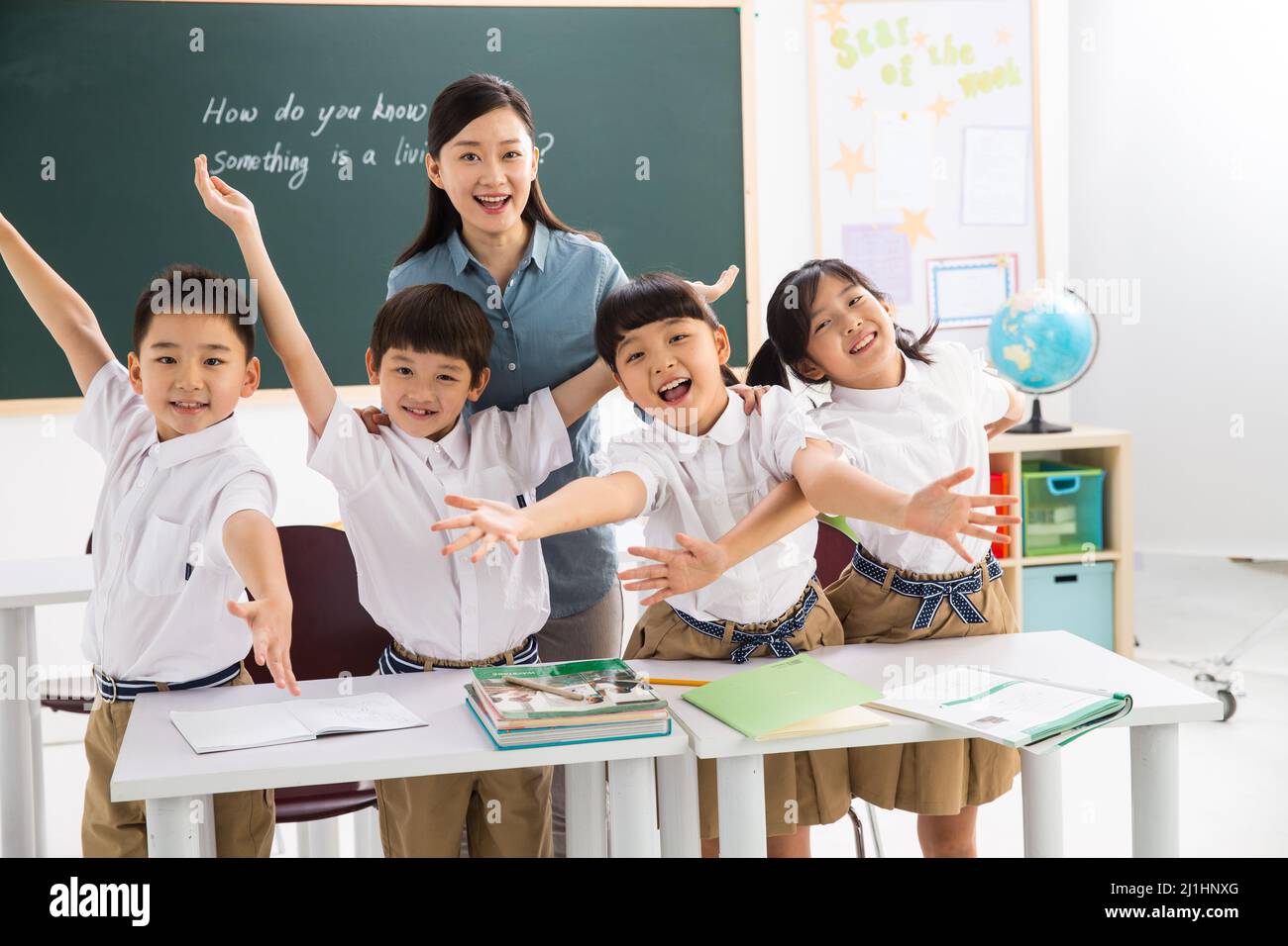 Teachers and pupils in the classroom Stock Photo - Alamy