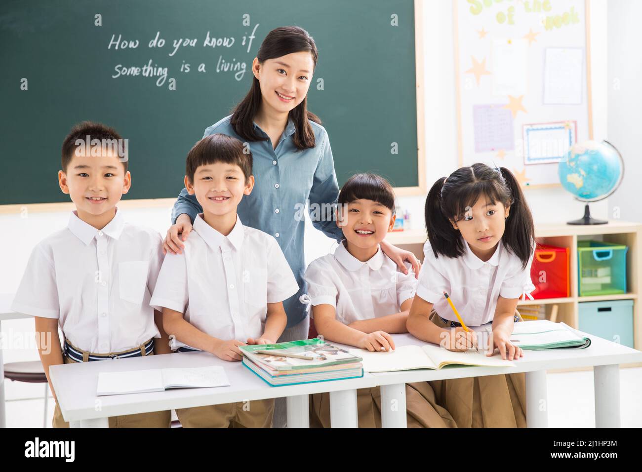 Teachers and pupils in the classroom Stock Photo - Alamy