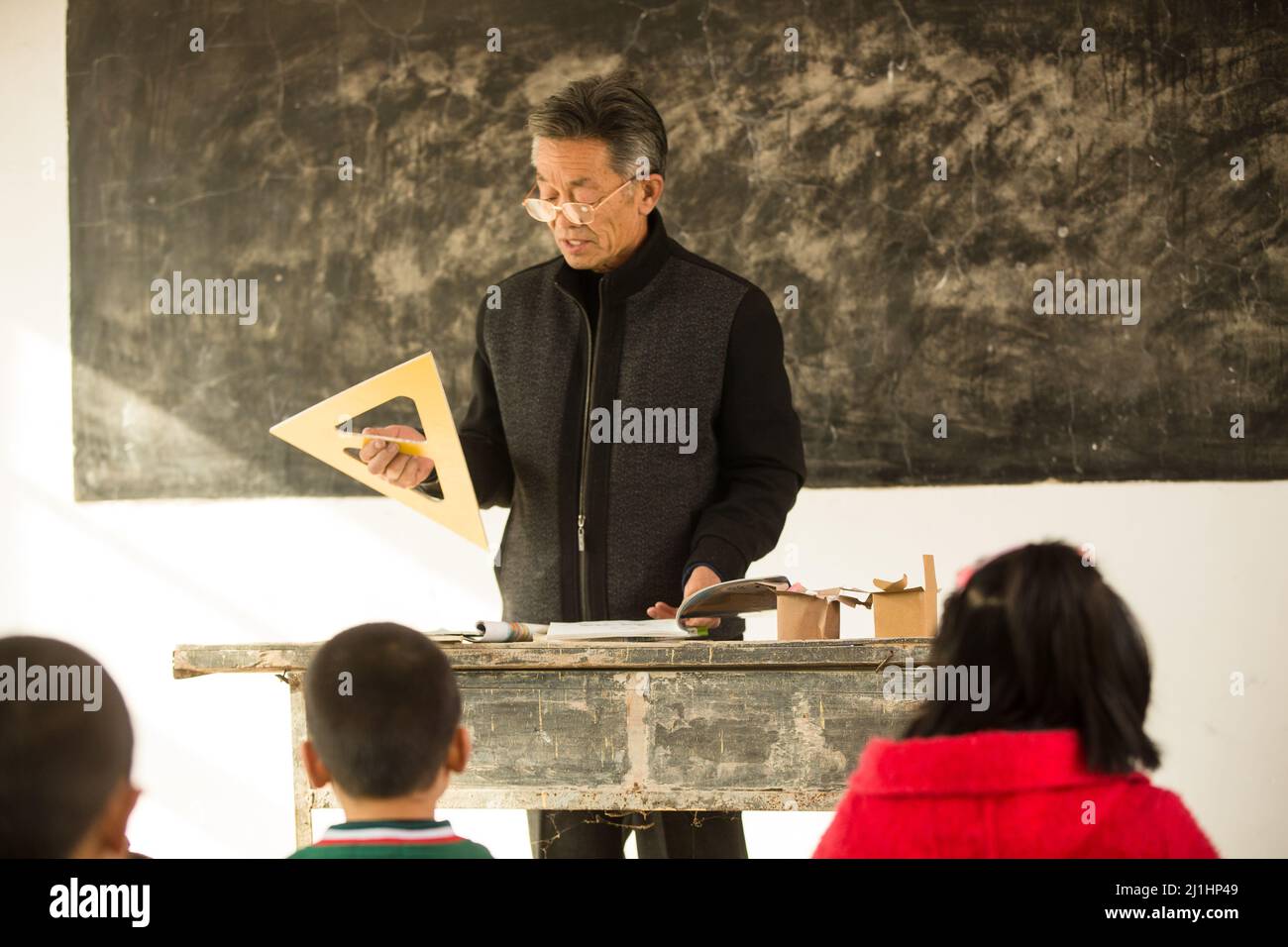 Rural male teachers and students in the classroom Stock Photo - Alamy