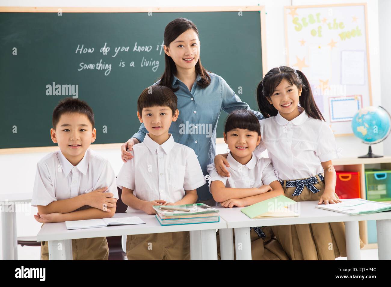 Teachers and pupils in the classroom Stock Photo - Alamy