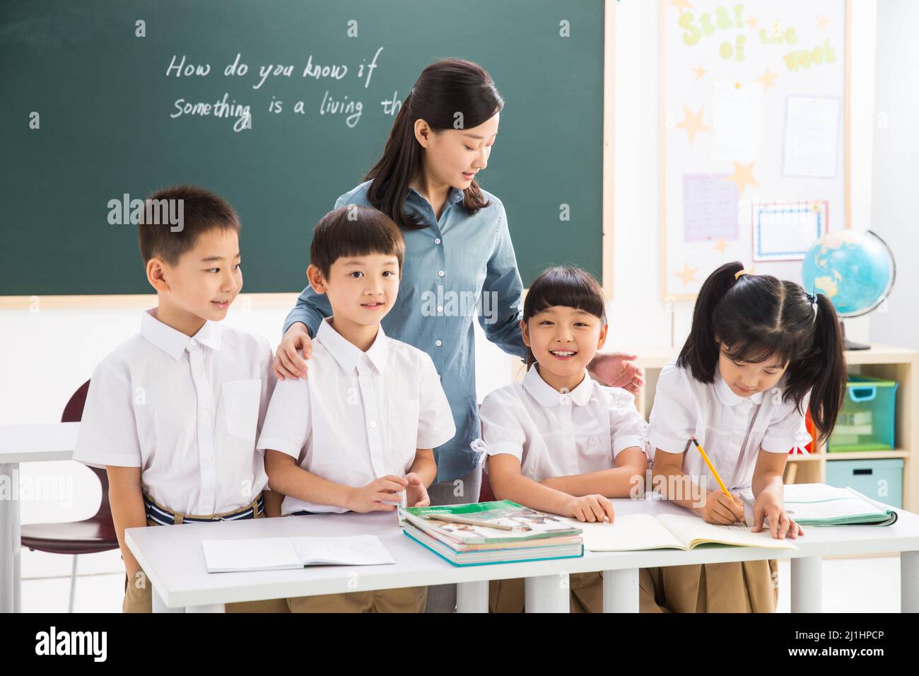 Teachers and pupils in the classroom Stock Photo - Alamy
