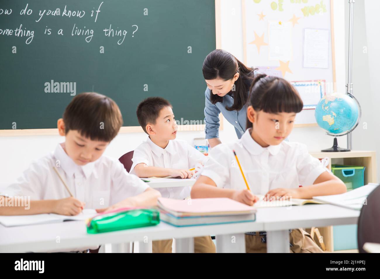 Teachers and pupils in the classroom Stock Photo - Alamy