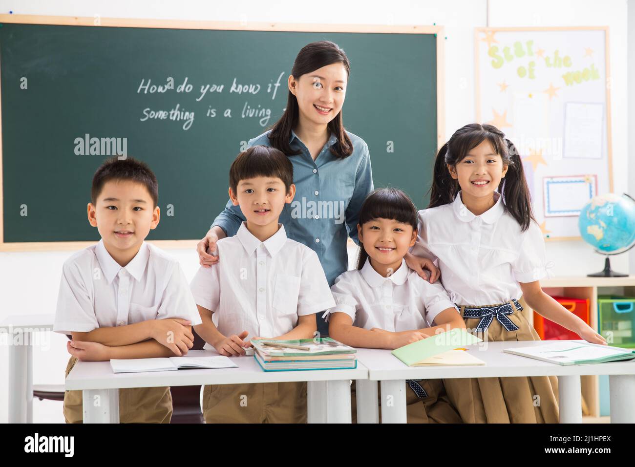 Teachers and pupils in the classroom Stock Photo - Alamy