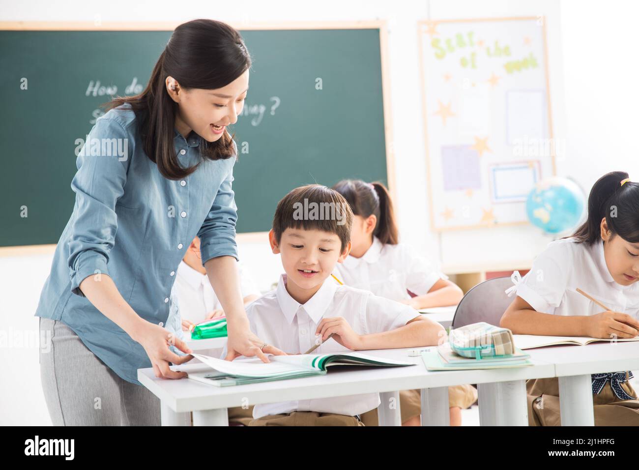Teachers and pupils in the classroom Stock Photo - Alamy