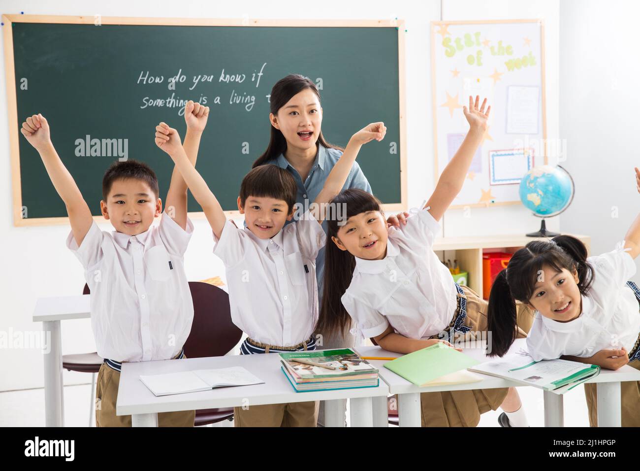 Teachers and pupils in the classroom Stock Photo - Alamy