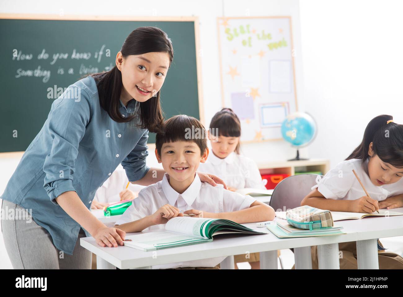 Teachers and pupils in the classroom Stock Photo - Alamy