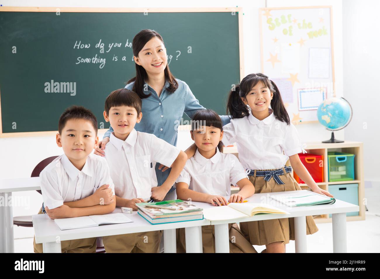Teachers and pupils in the classroom Stock Photo - Alamy