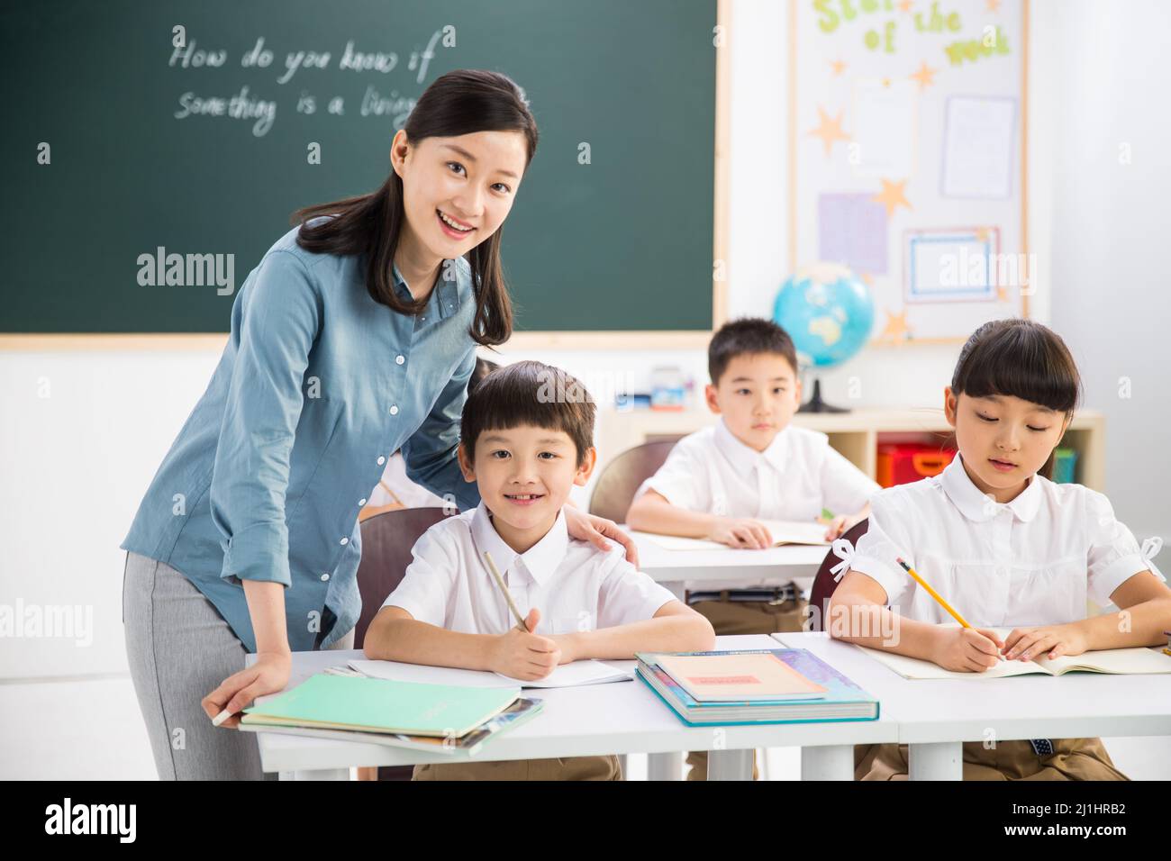 Teachers and pupils in the classroom Stock Photo - Alamy