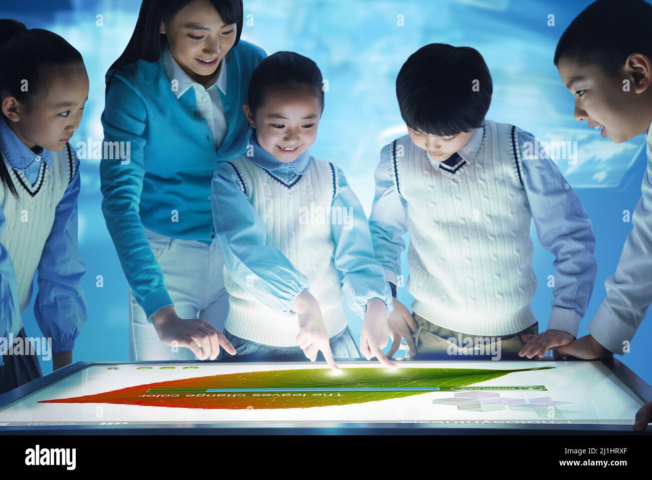 Elementary school students and teachers in class Stock Photo - Alamy