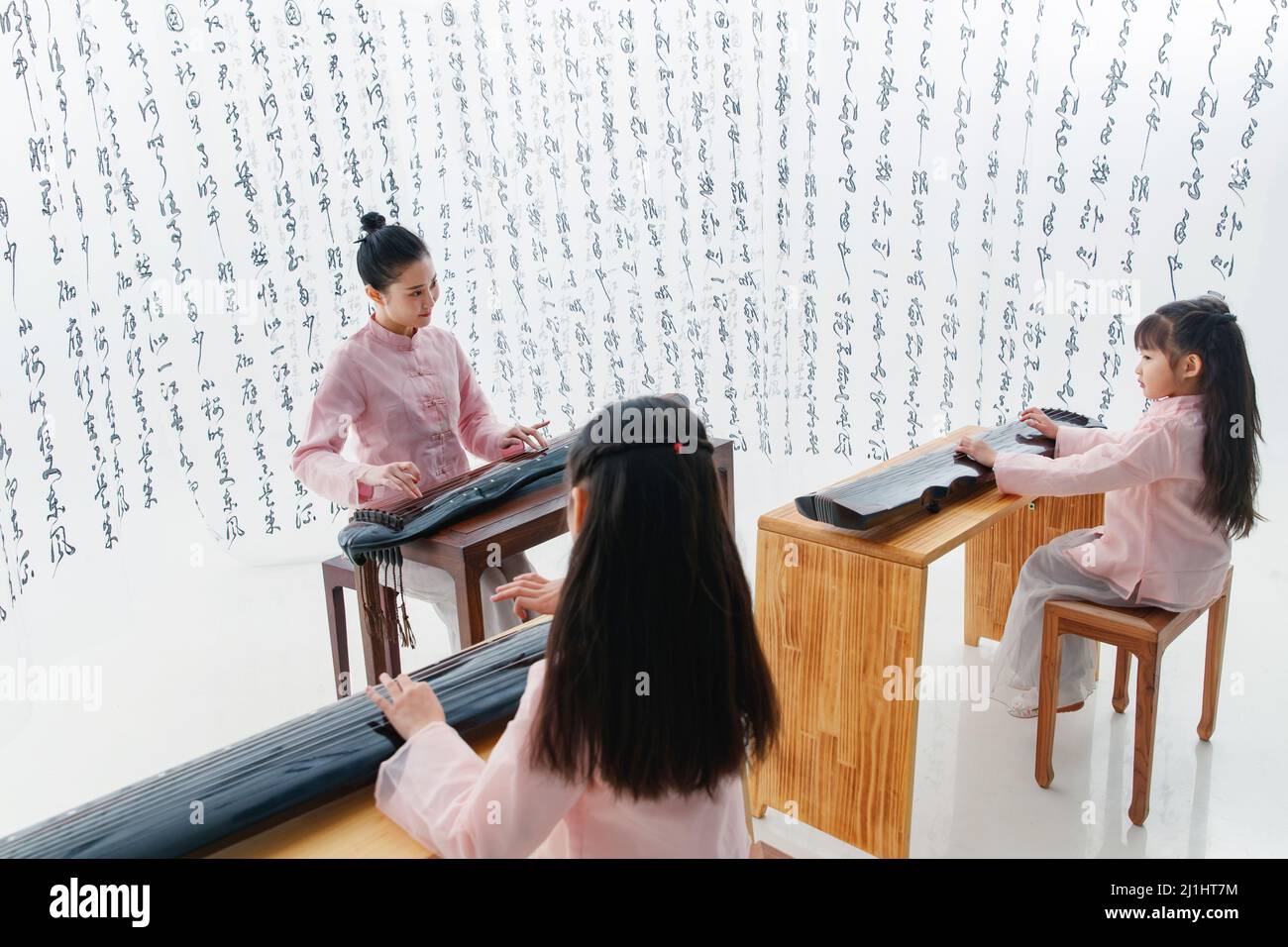 The youth teacher taught the pupils learn guzheng Stock Photo Alamy