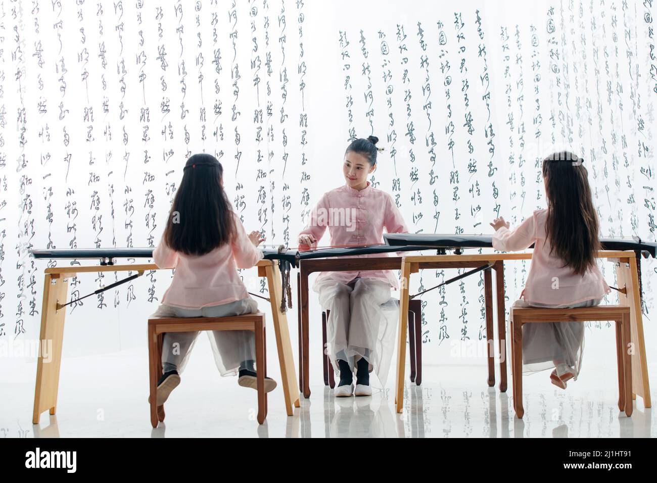 The youth teacher taught the pupils learn guzheng Stock Photo Alamy