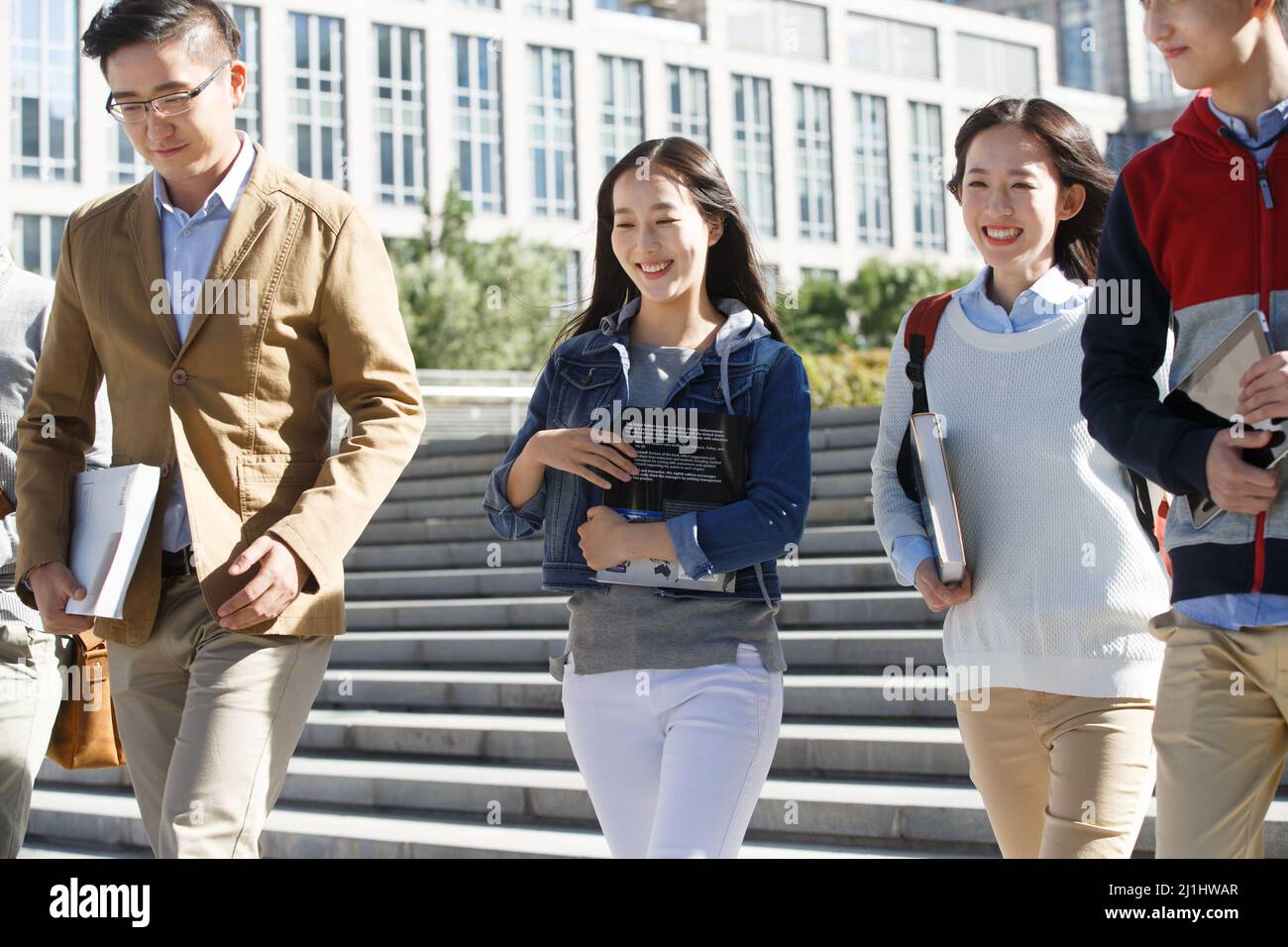 The teacher and the student walking and talking Stock Photo - Alamy
