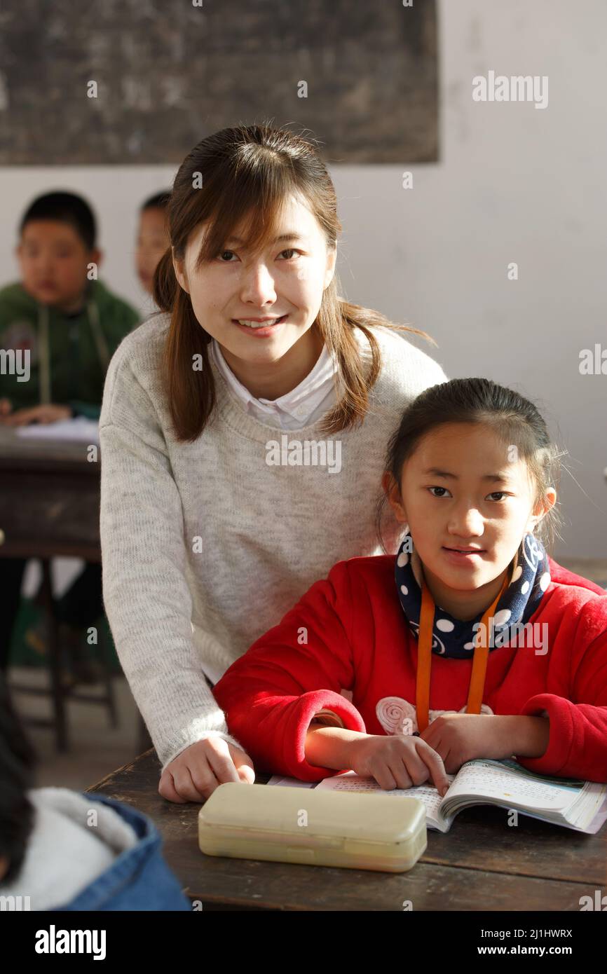 Rural female teachers and pupils in the classroom Stock Photo - Alamy
