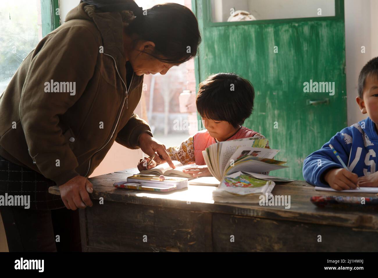 Rural female teachers and pupils in the classroom Stock Photo - Alamy