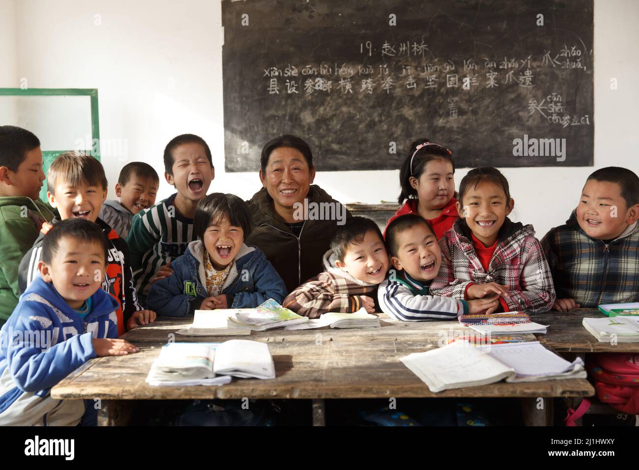 Rural female teachers and pupils in the classroom Stock Photo - Alamy