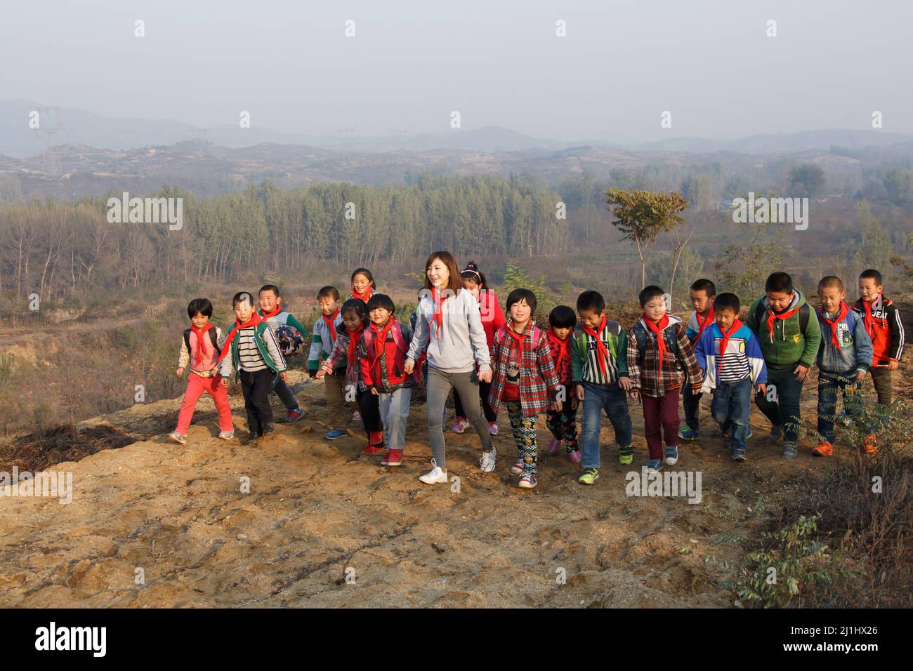 Small Group Teaching Rural Rural female teachers and students play Stock Photo - Alamy
