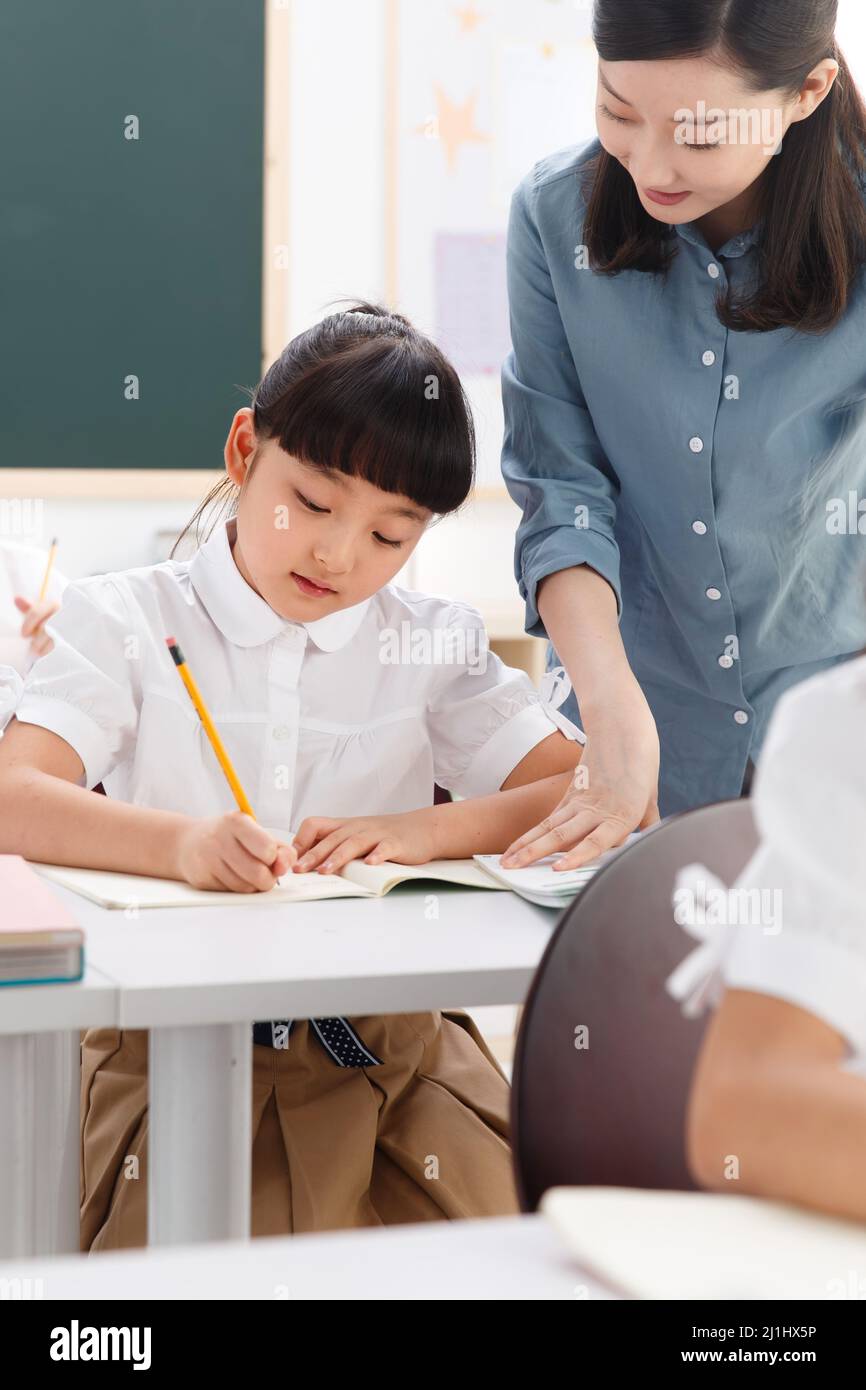 The teachers and pupils are in the classroom Stock Photo - Alamy