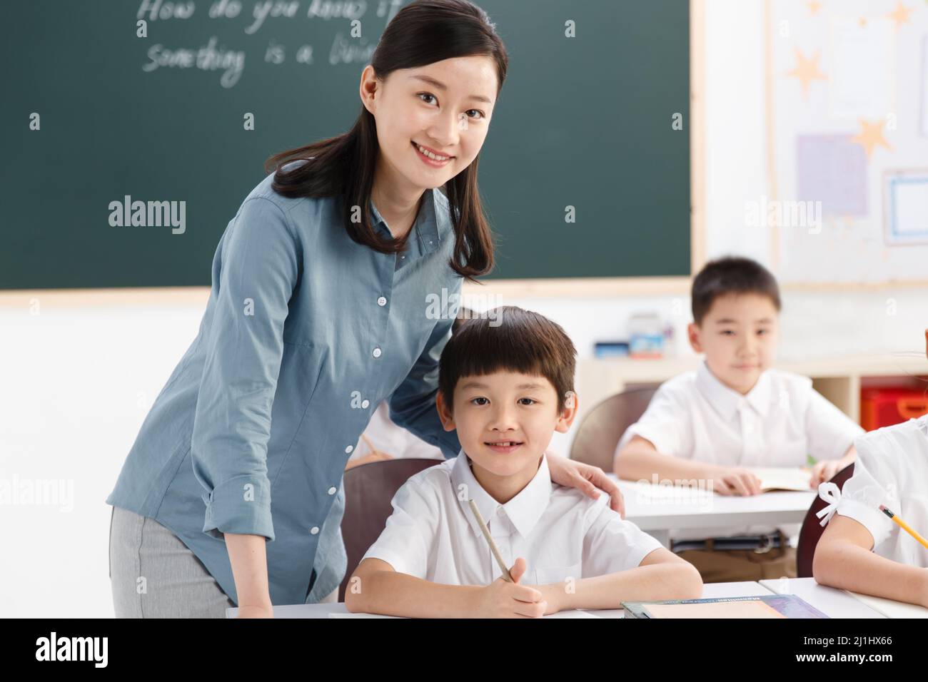 The teachers and pupils are in the classroom Stock Photo - Alamy