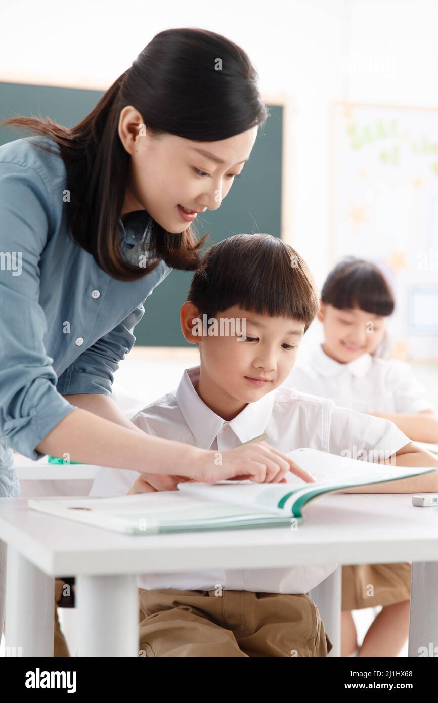 The teachers and pupils are in the classroom Stock Photo - Alamy