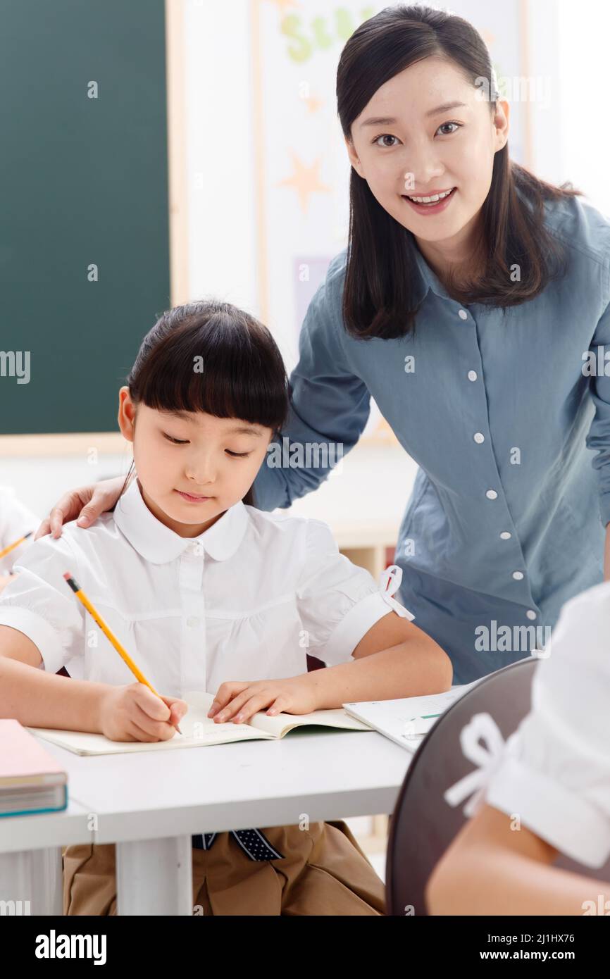 The teachers and pupils are in the classroom Stock Photo - Alamy
